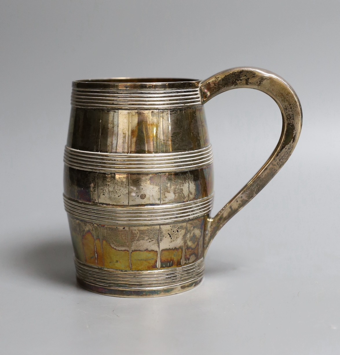A George III silver barrel shaped pint mug, with reeded bands, Thomas Law, Sheffield, 1802, 12.7cm, 9.50z.